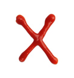 Photo of Letter X written with ketchup on white background