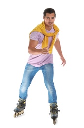 Photo of Handsome young man with inline roller skates on white background