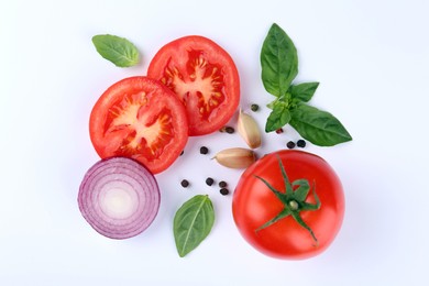 Photo of Flat lay composition with whole and cut tomatoes on white background
