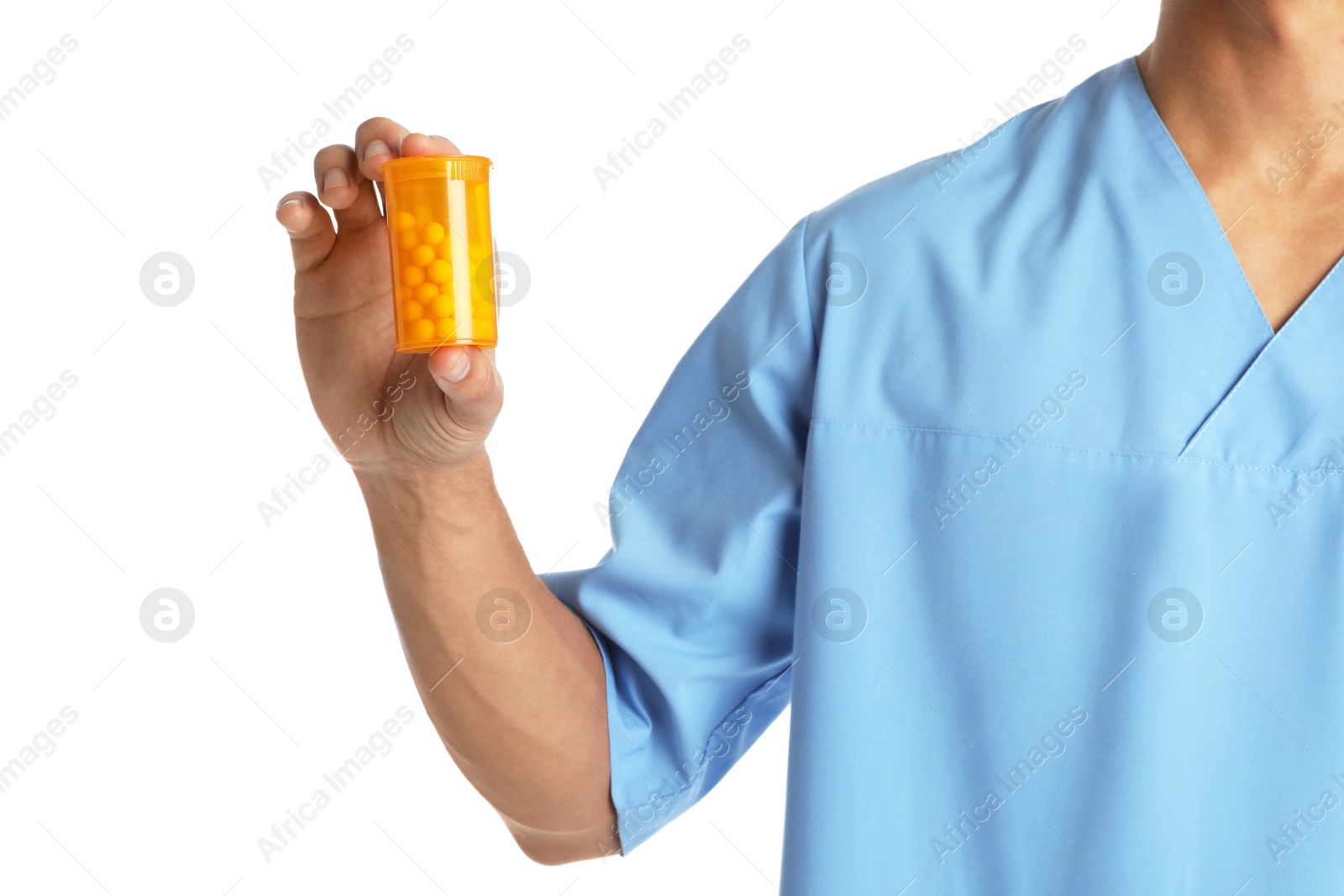 Photo of Male doctor holding pill bottle on white background, closeup. Medical object