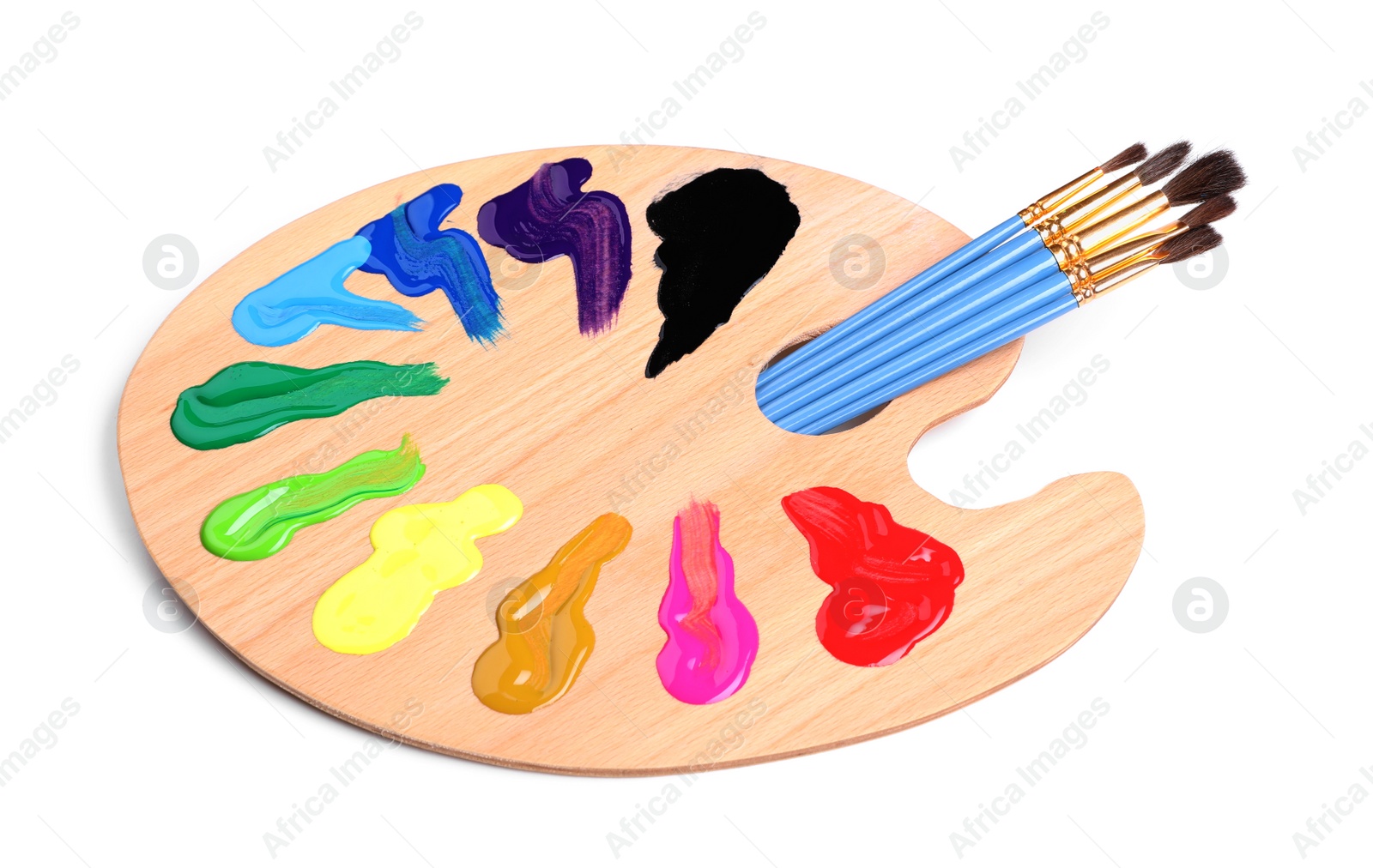 Photo of Palette with paints and brushes on white background. Artist equipment