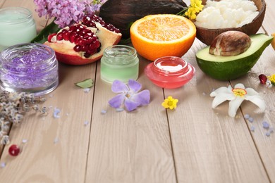 Photo of Homemade cosmetic products and fresh ingredients on wooden table, space for text. DIY beauty recipe