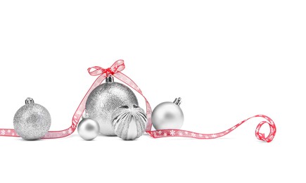 Beautiful Christmas balls and red ribbon isolated on white