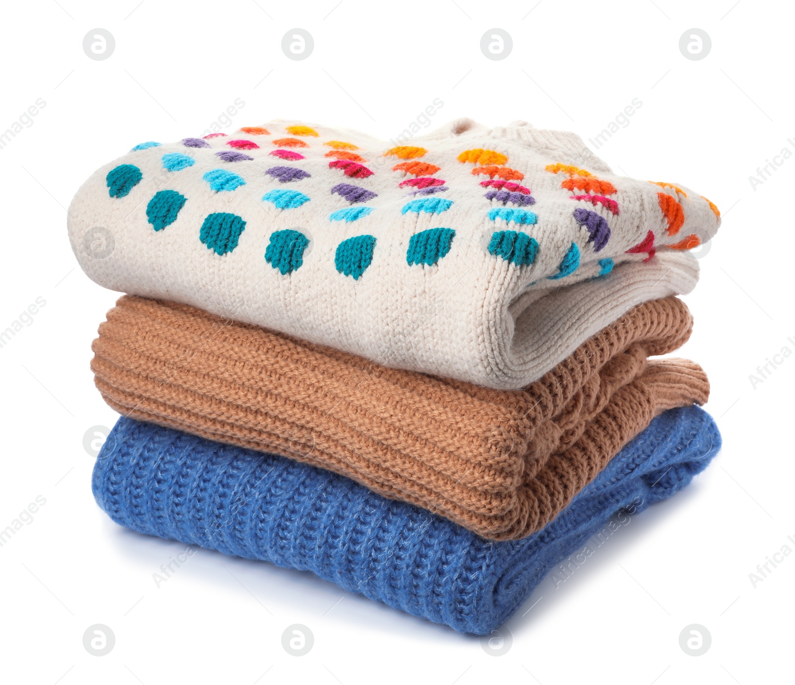 Photo of Stack of folded knitted sweaters on white background