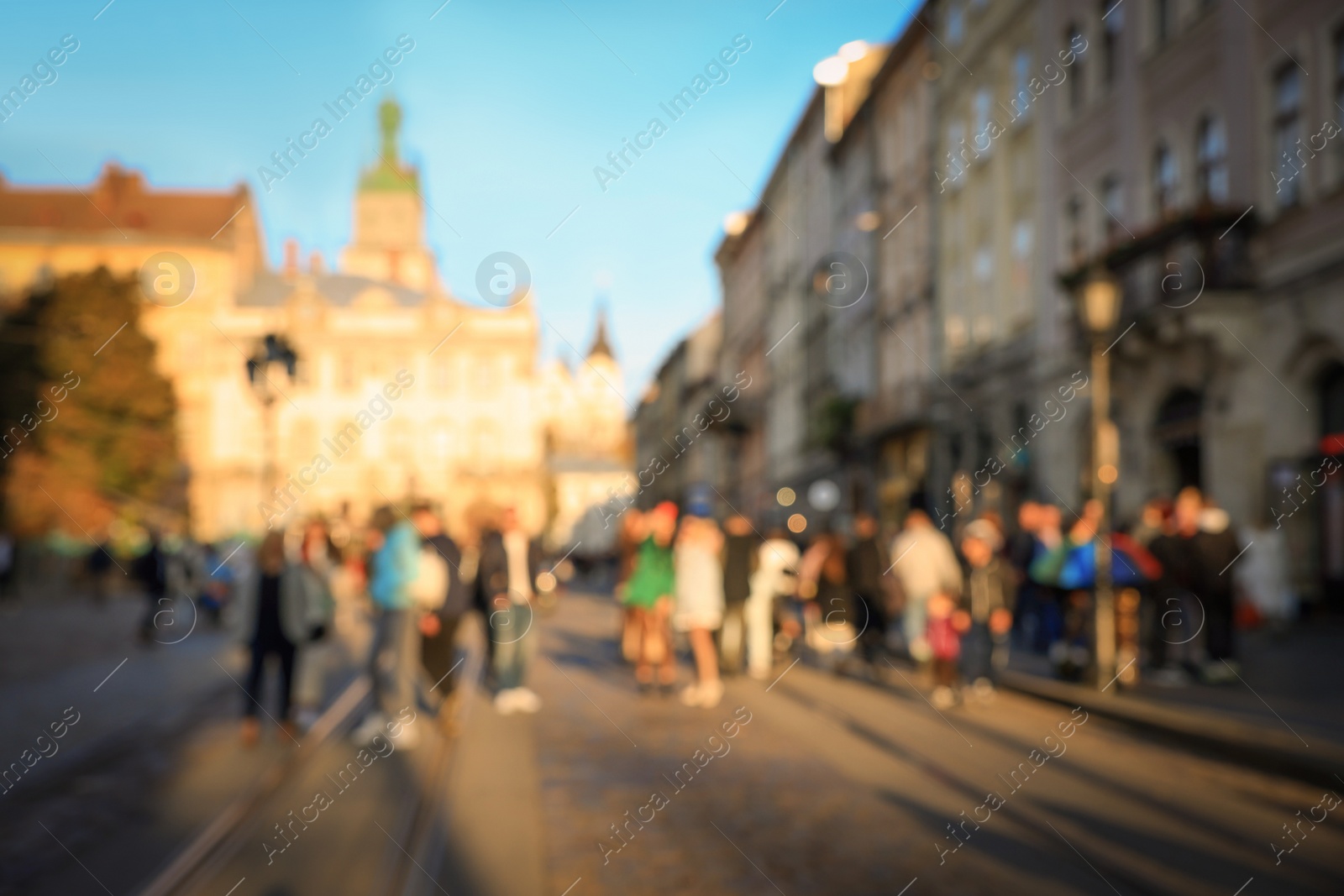 Photo of Blurred view of people walking on city street