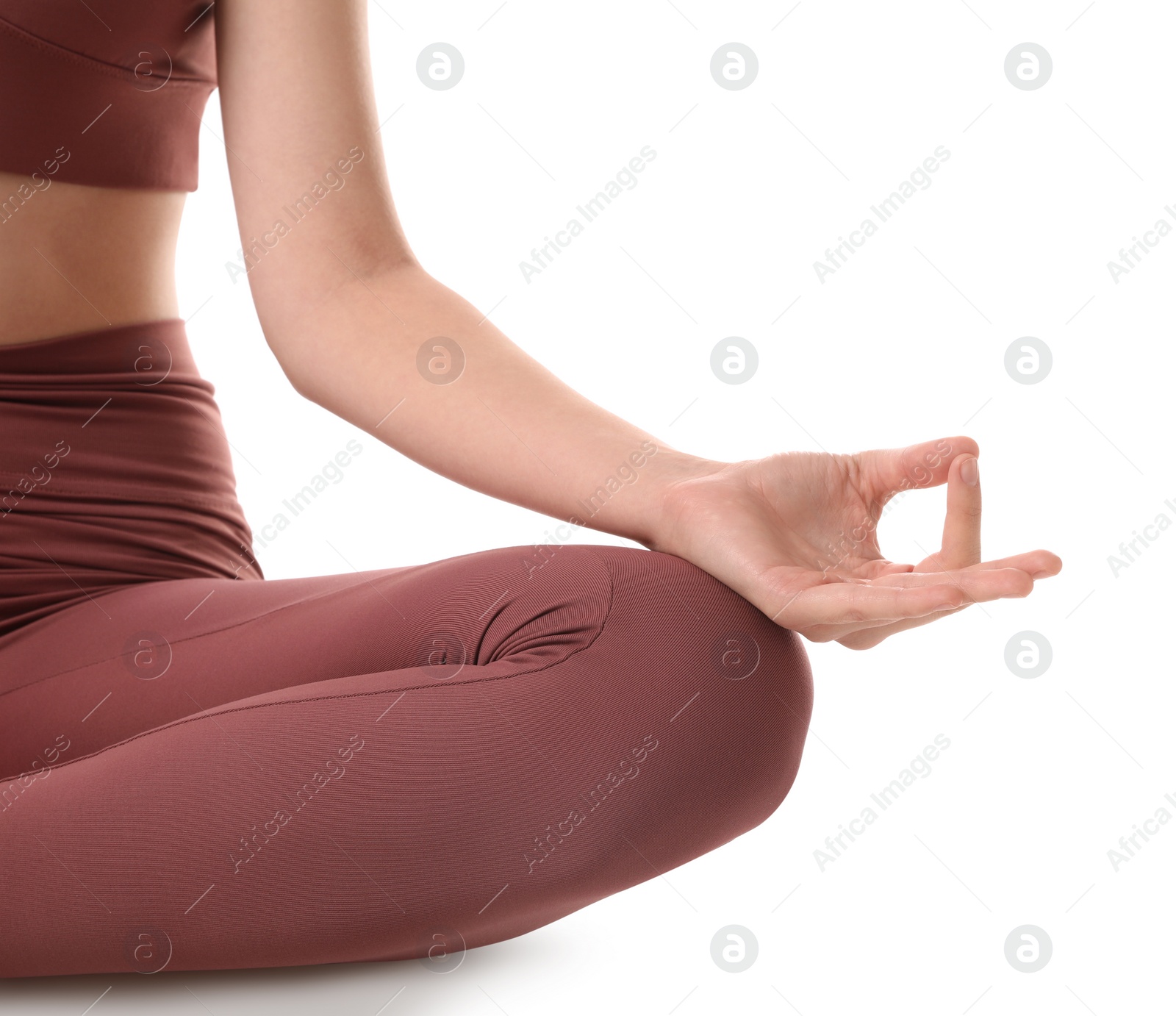 Photo of Woman in sportswear meditating on white background, closeup