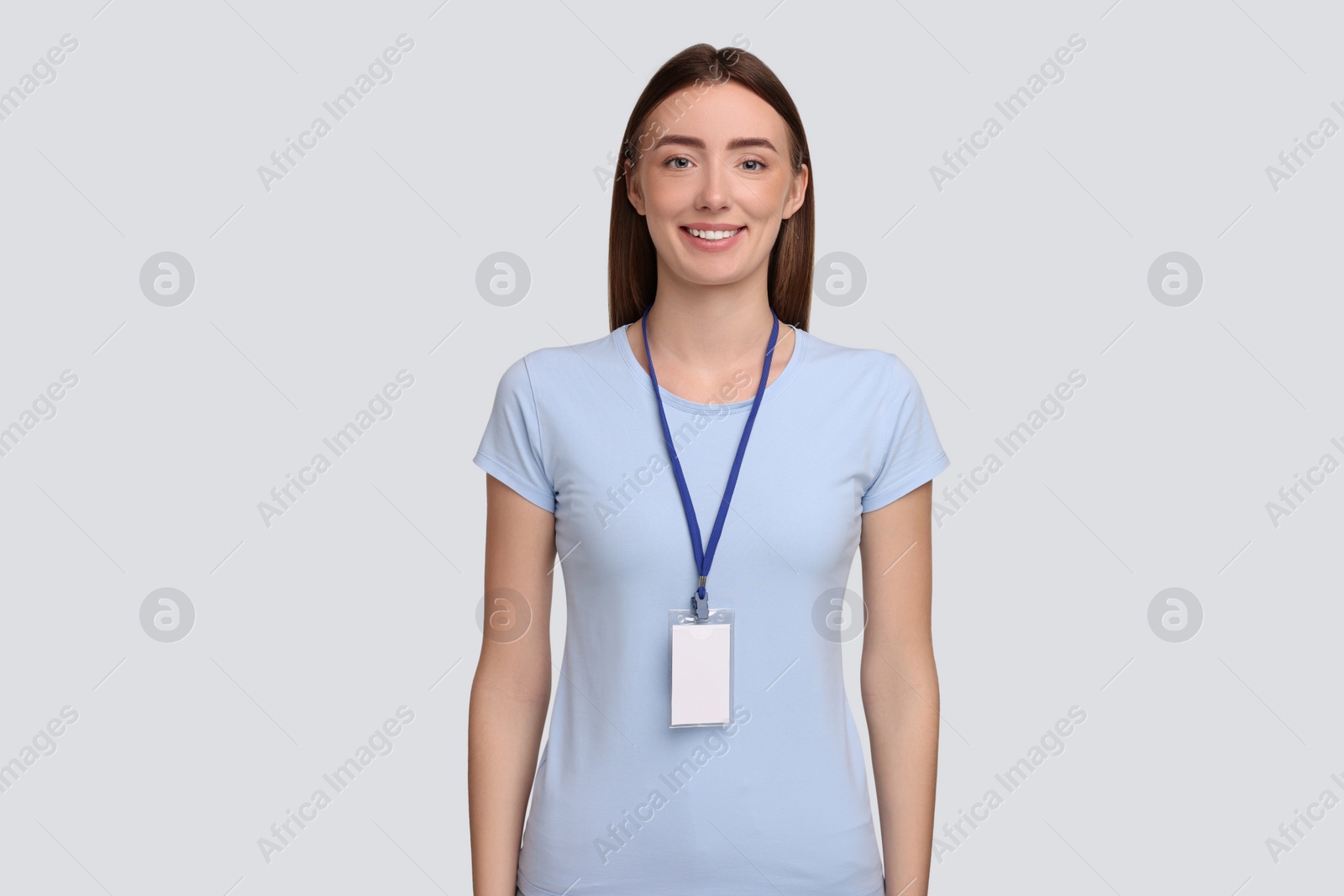 Photo of Woman with blank badge on grey background