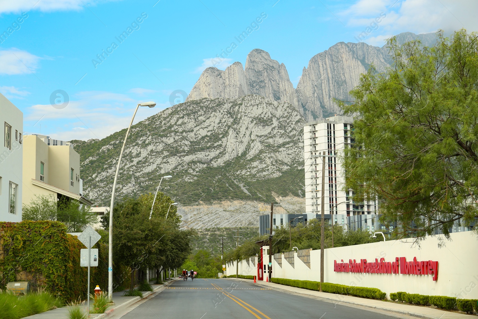 Photo of Mexico, San Pedro Garza Garcia - August 27, 2022: City street near beautiful mountains