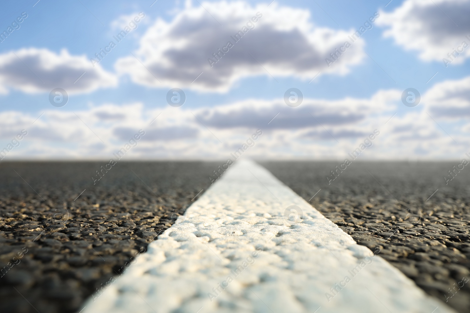 Image of View of empty asphalt road on sunny day