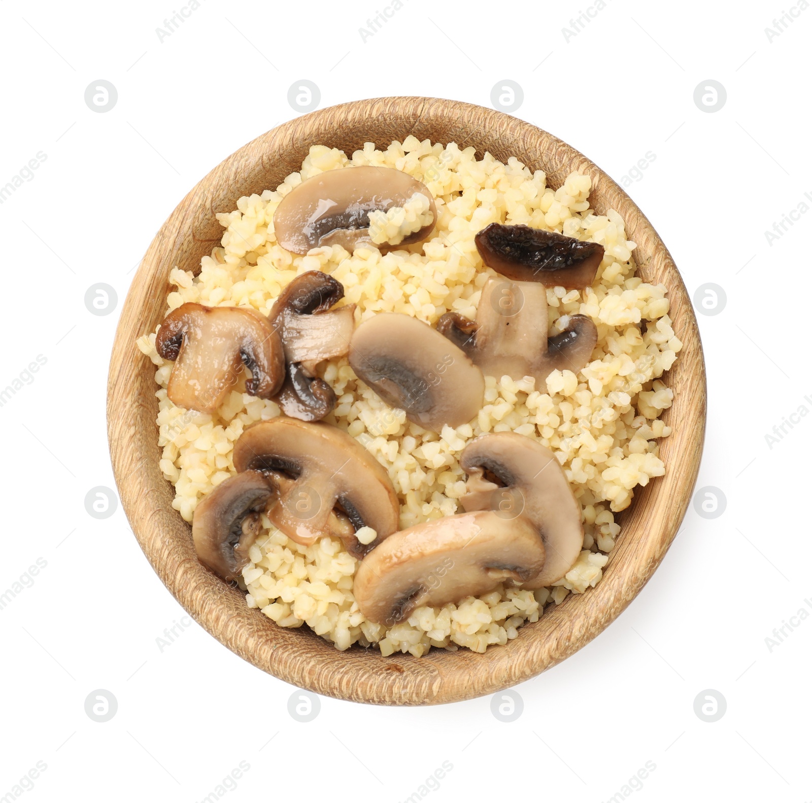 Photo of Delicious bulgur with mushrooms in bowl isolated on white, top view