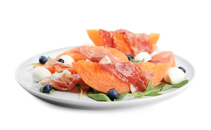 Photo of Fresh melon with prosciutto, mozzarella and arugula on white background