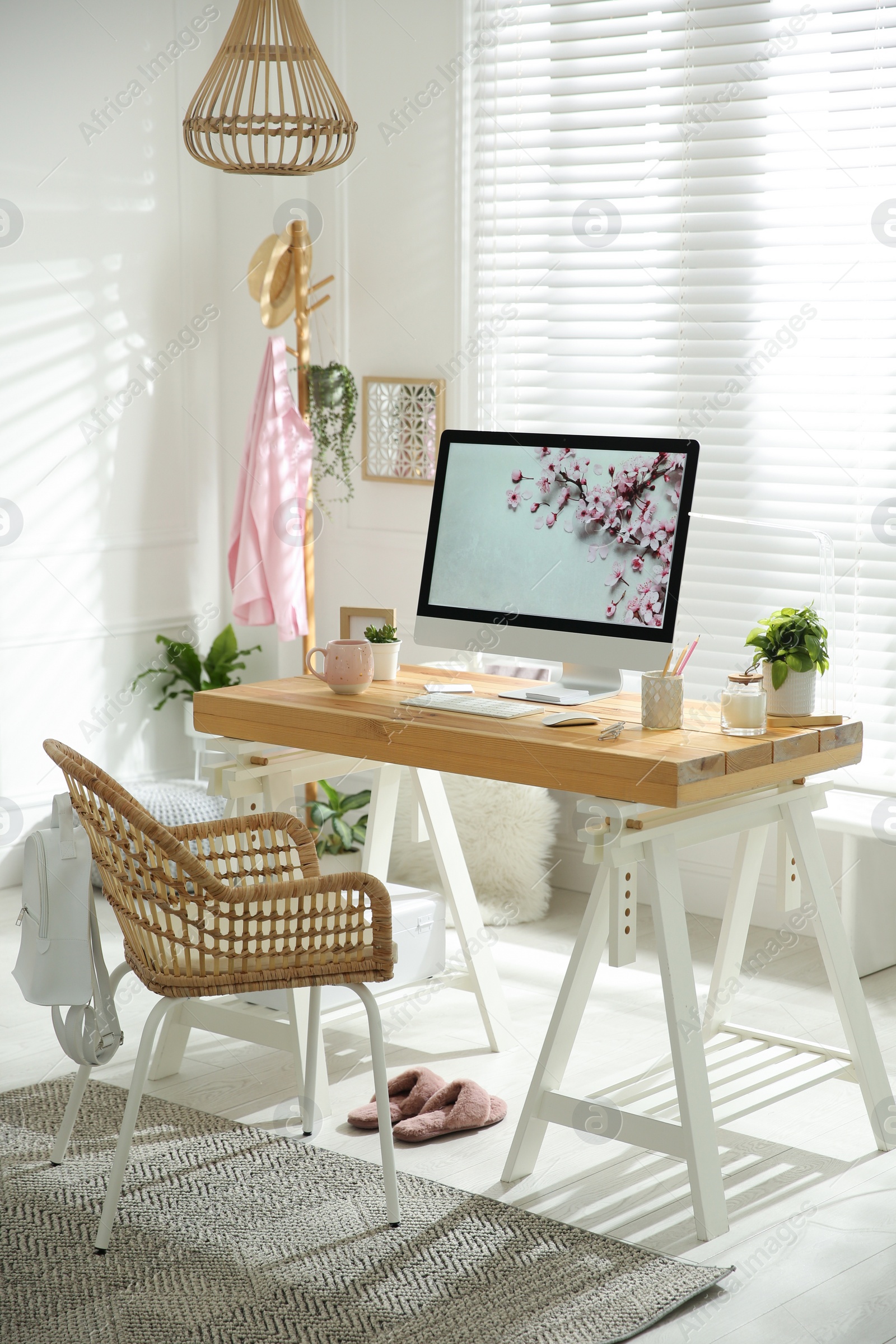 Photo of Stylish home office interior with comfortable workplace