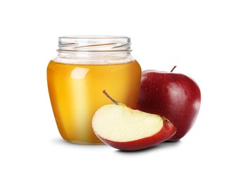 Image of Honey in glass jar and apples isolated on white