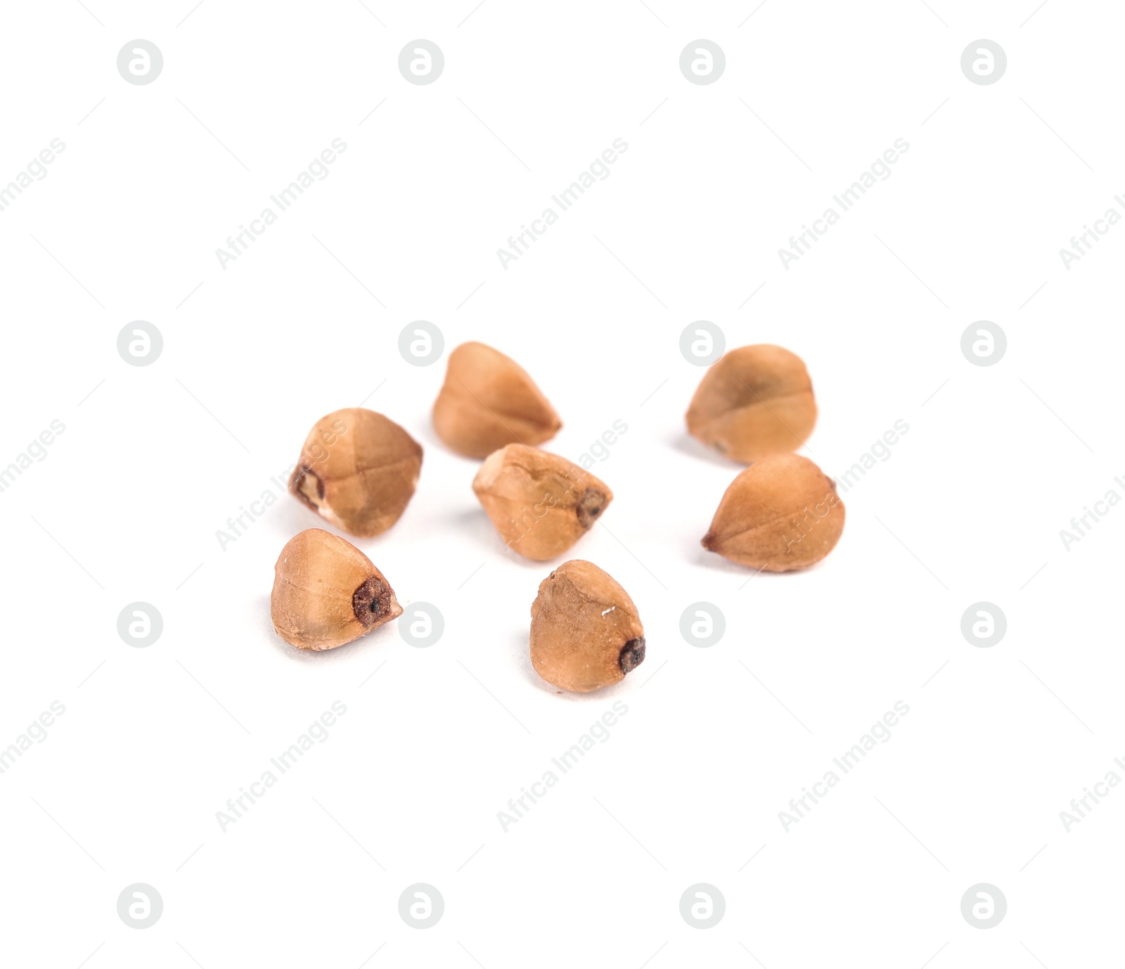 Photo of Uncooked buckwheat on white background. Healthy diet