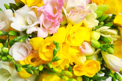 Photo of Beautiful colorful freesia bouquet as background, closeup