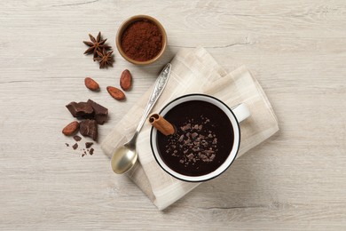 Flat lay composition with yummy hot chocolate on white wooden table