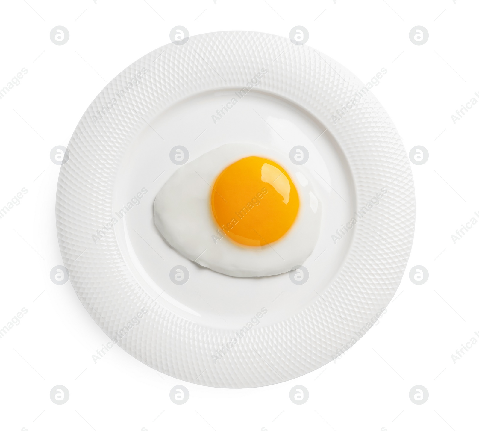 Photo of Plate with tasty fried egg isolated on white, top view