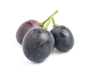 Photo of Delicious dark blue grapes isolated on white