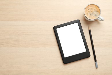 Photo of Modern e-book reader, coffee and pencil on wooden table, flat lay. Space for text