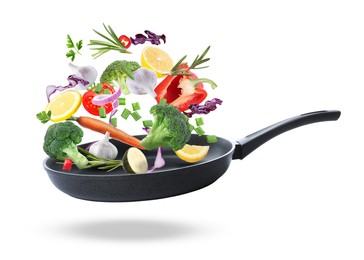 Tasty fresh ingredients and frying pan on white background