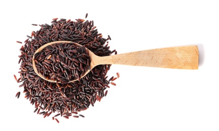 Photo of Spoon with uncooked black rice on white background, top view