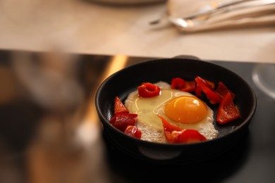 Photo of Frying pan with tasty egg and vegetables on stove