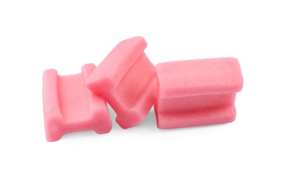 Photo of Tasty pink chewing gums on white background