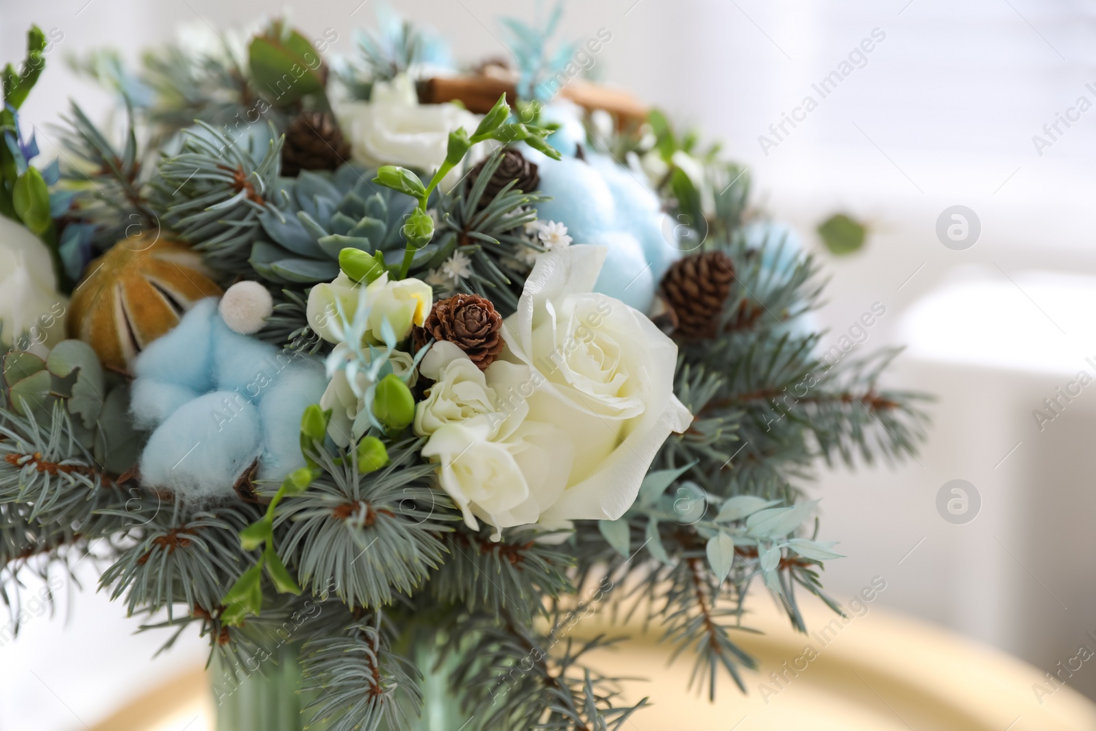Photo of Beautiful wedding winter bouquet indoors, closeup view