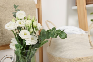Beautiful bouquet of white eustoma flowers indoors