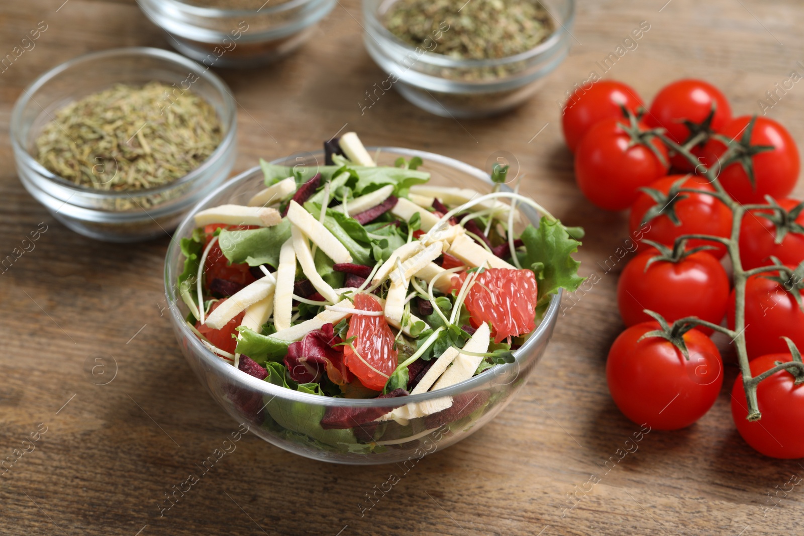 Photo of Delicious carrot salad served on wooden table, closeup