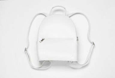 Stylish urban backpack on white background, top view