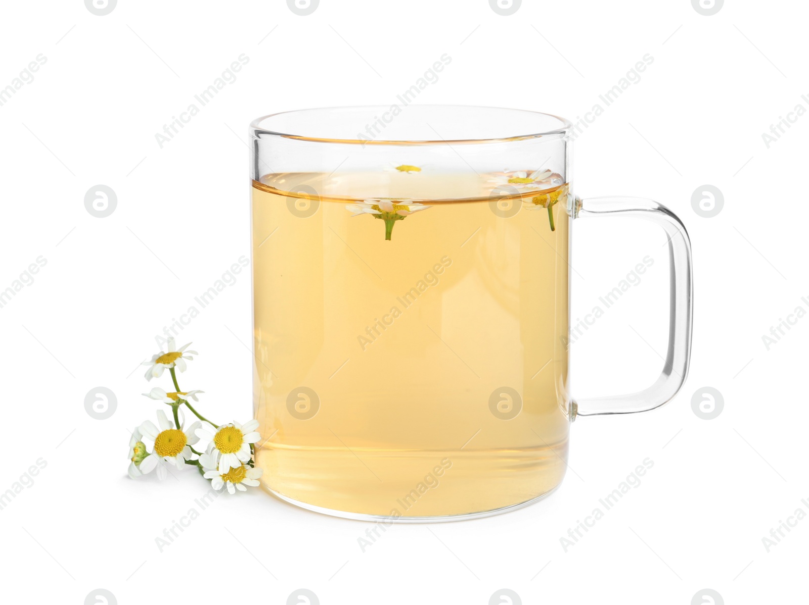 Photo of Delicious chamomile tea in glass cup isolated on white