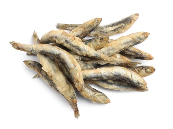 Photo of Pile of delicious fried anchovies on white background, top view