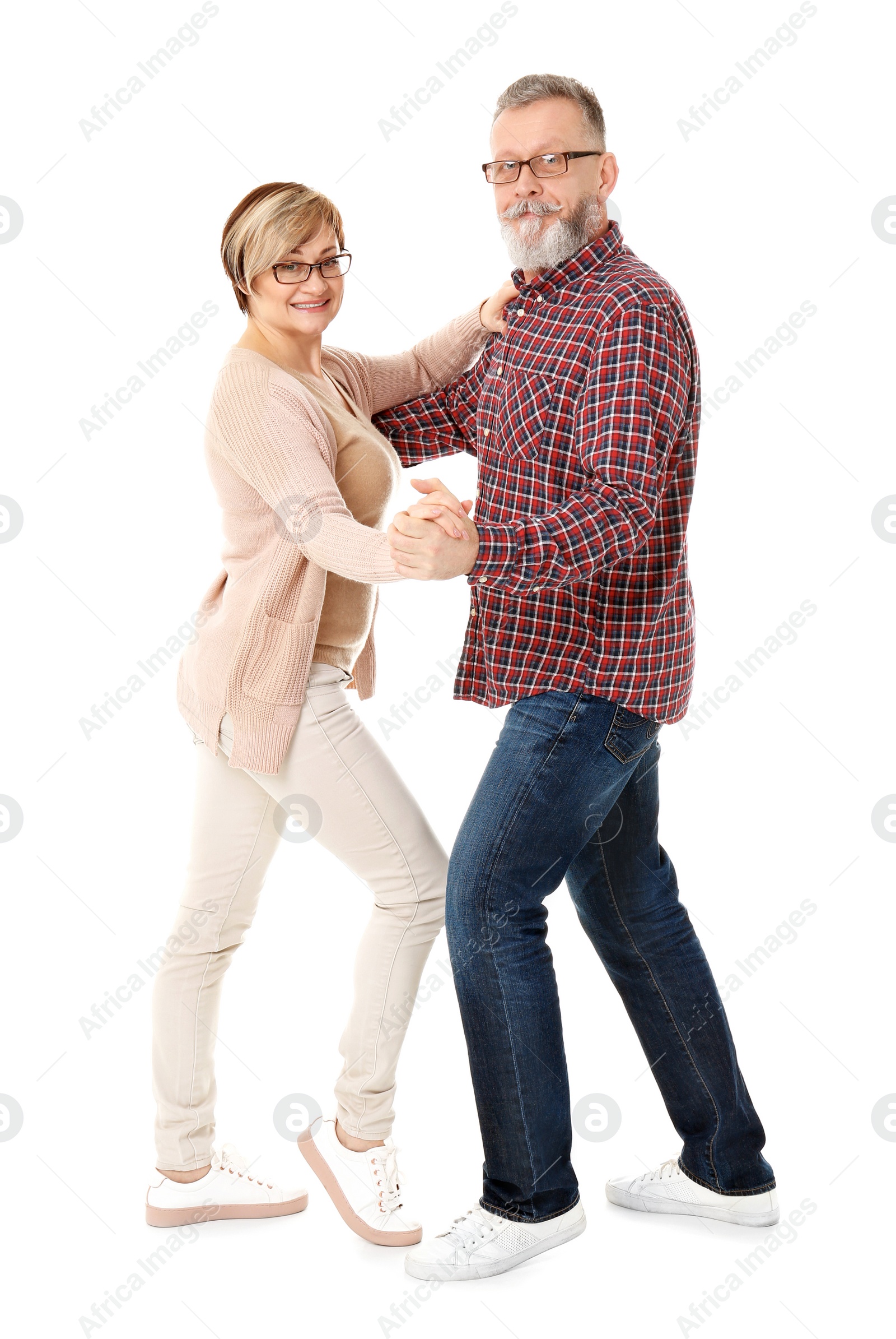 Photo of Happy senior couple dancing on white background