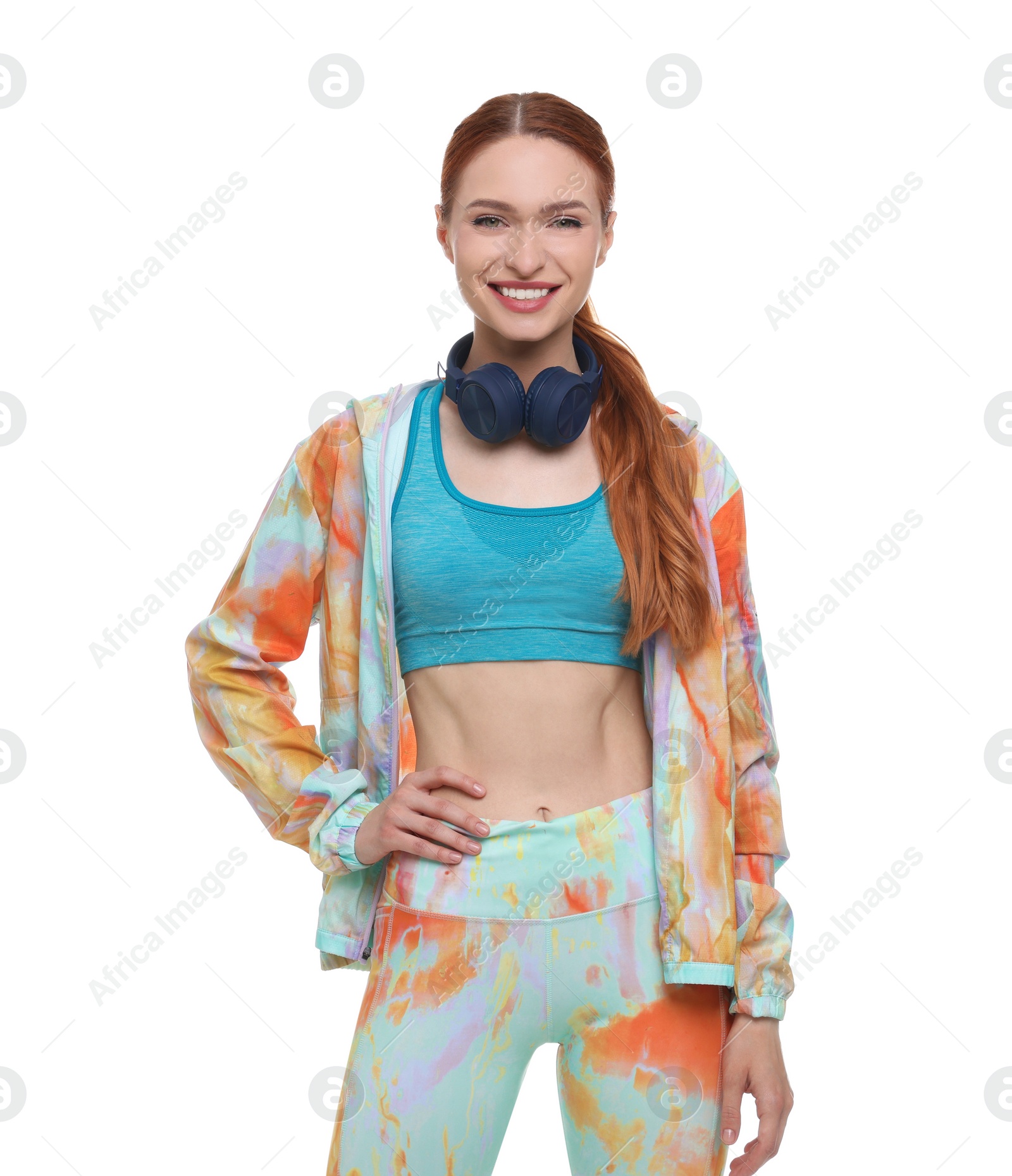 Photo of Young woman in sportswear and headphones on white background