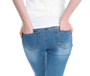 Photo of Young woman in stylish jeans on white background