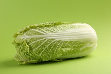 Photo of Fresh ripe Chinese cabbage on light green background