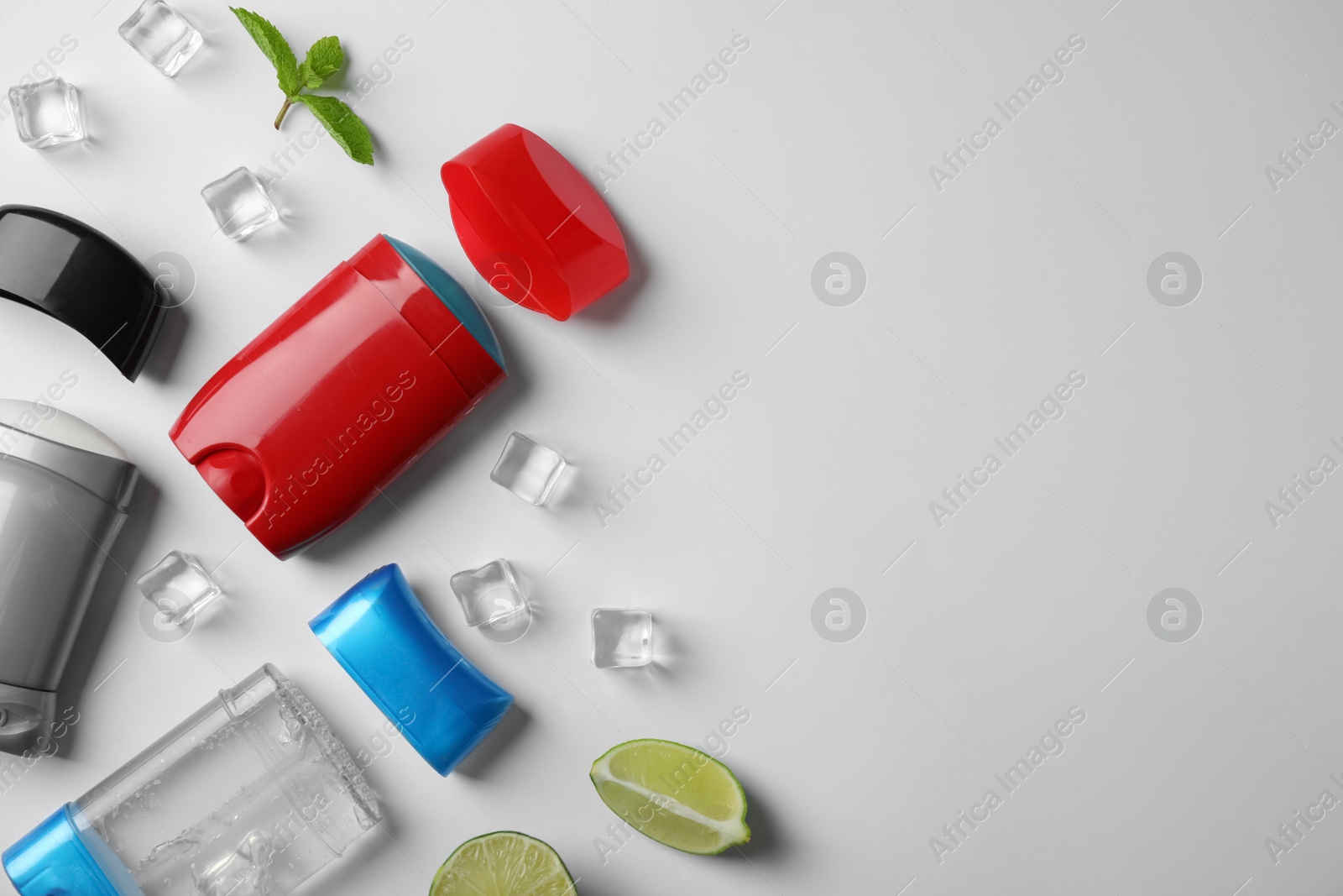 Photo of Composition with male deodorants on white background, top view