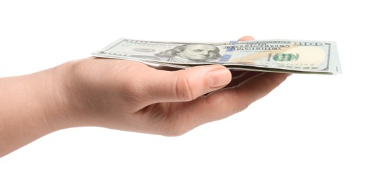 Money exchange. Woman holding dollar banknotes on white background, closeup