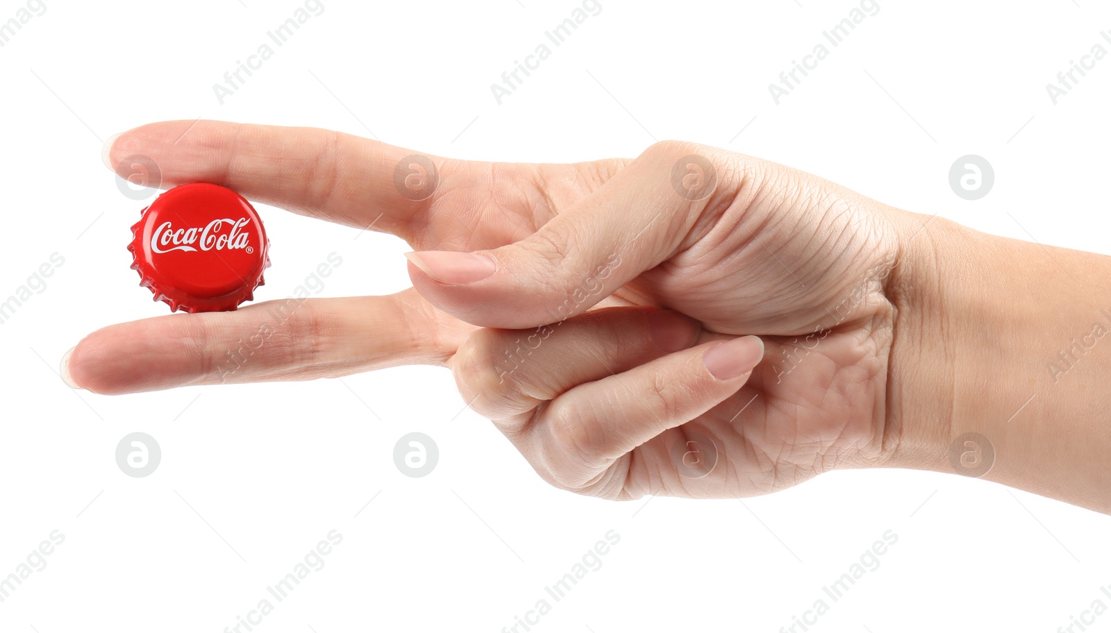 Photo of MYKOLAIV, UKRAINE - NOVEMBER 15, 2018: Woman holding Coca Cola lid on white background