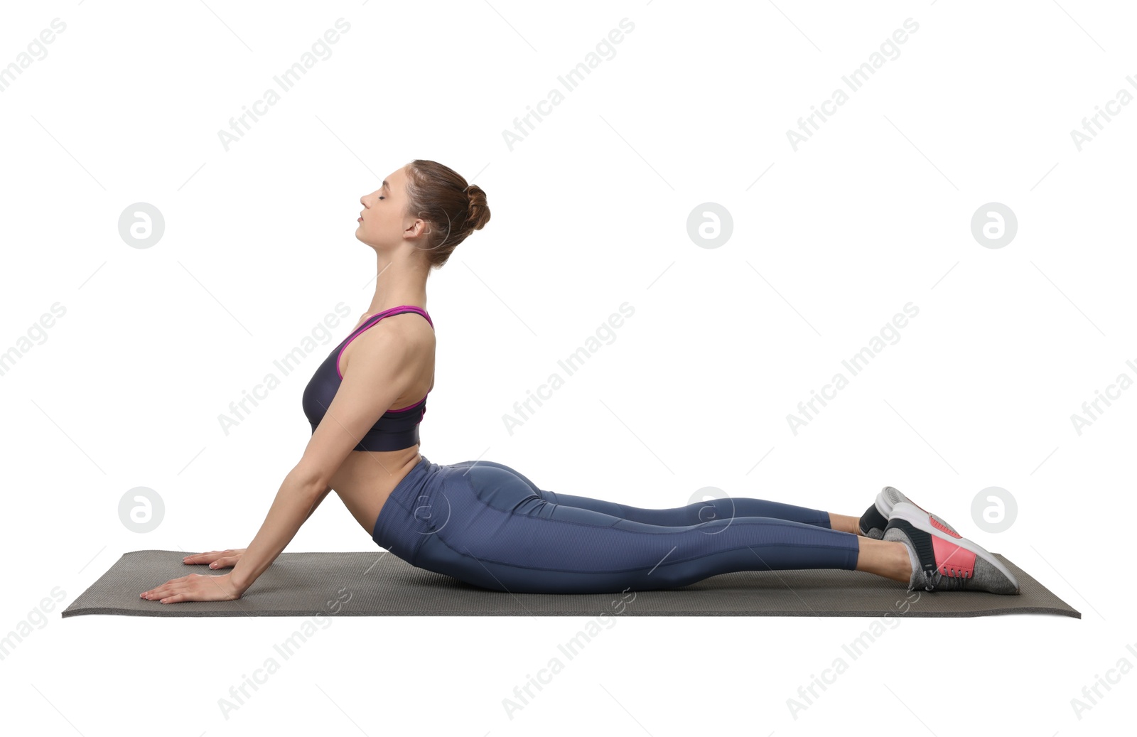 Photo of Young woman practicing yoga on white background