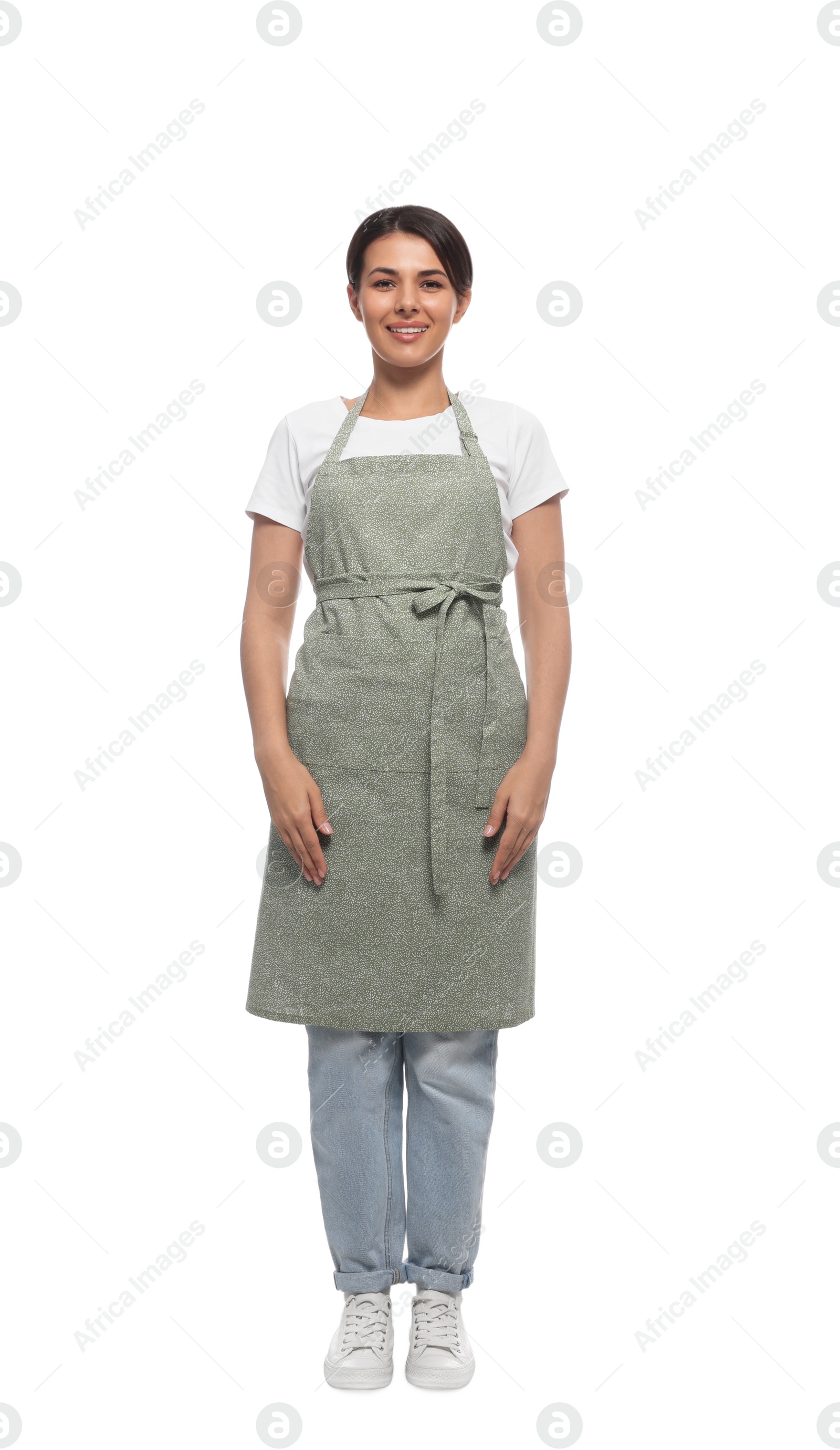 Photo of Young woman in green apron on white background