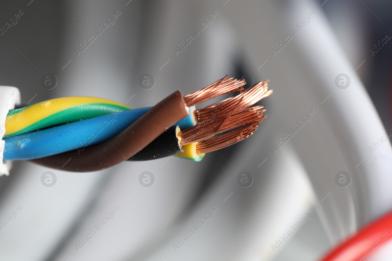 Photo of Colorful electrical wire on blurred background, closeup