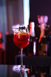 Glass of delicious refreshing sangria on counter in bar