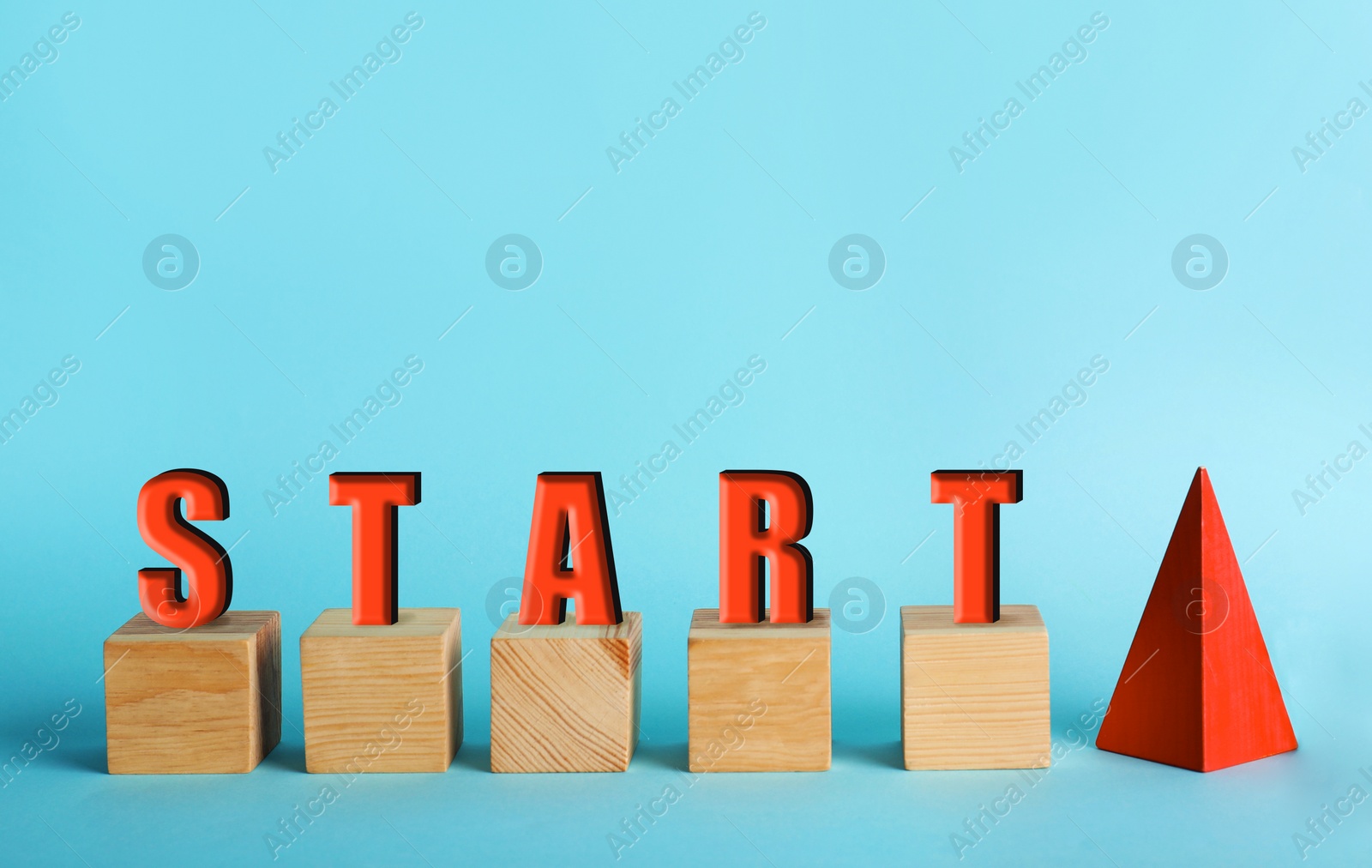 Image of Red pyramid, wooden cubes and word START on light blue background