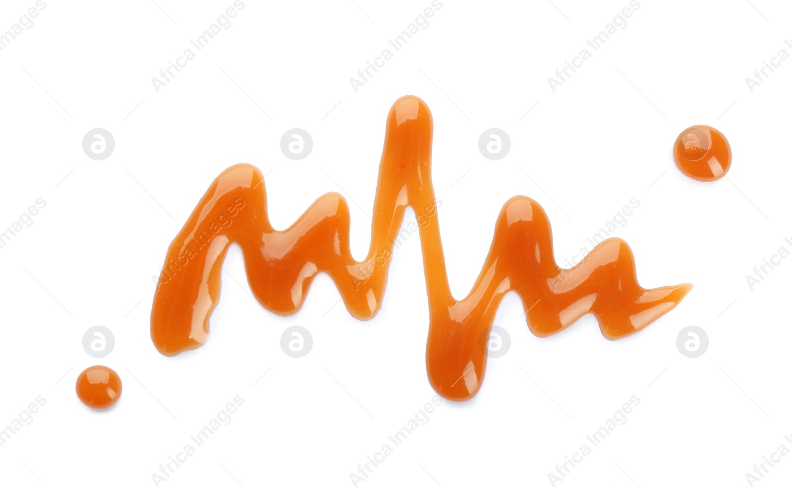 Photo of Stroke of delicious caramel sauce on white background, top view