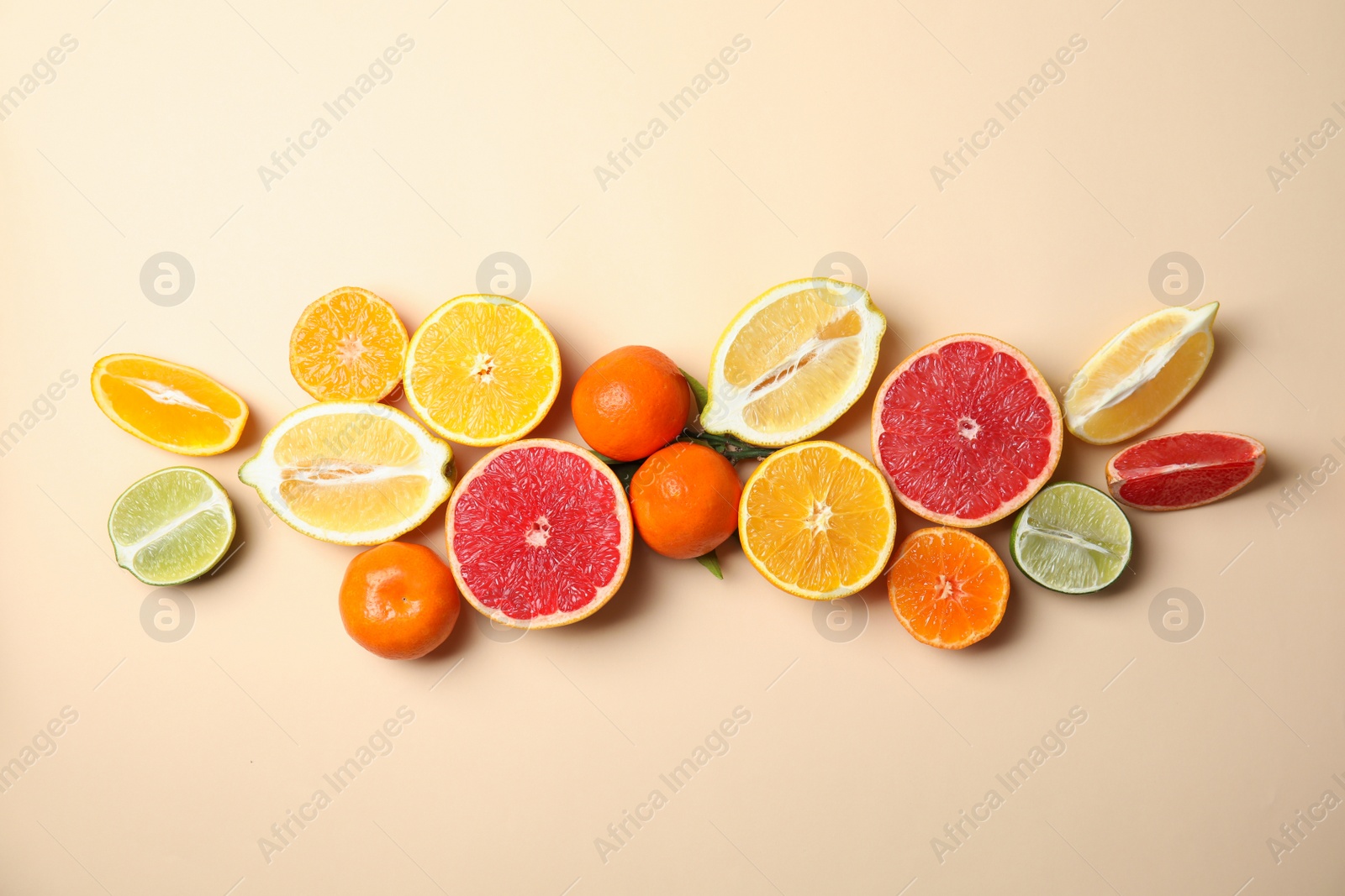 Photo of Different citrus fruits on color background, top view