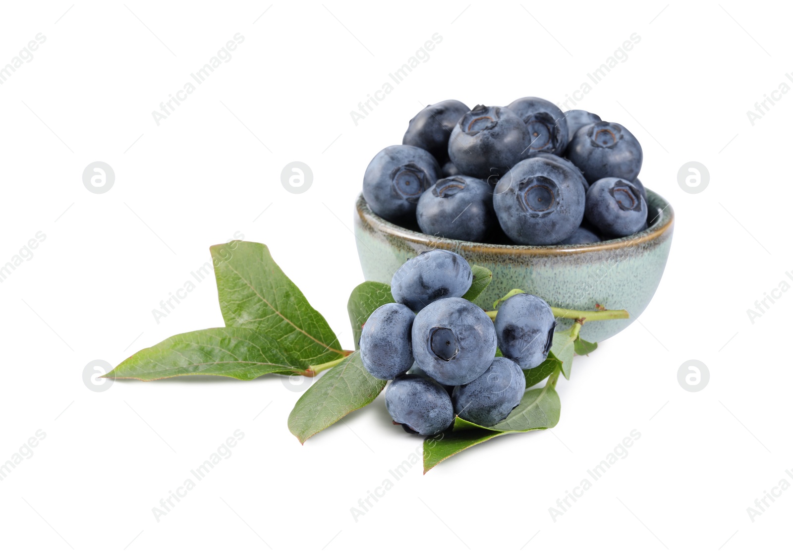 Photo of Fresh ripe blueberries and leaves isolated on white