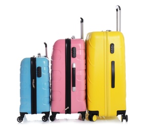 Modern suitcases for travelling on white background