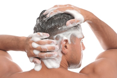 Man washing hair on white background, closeup
